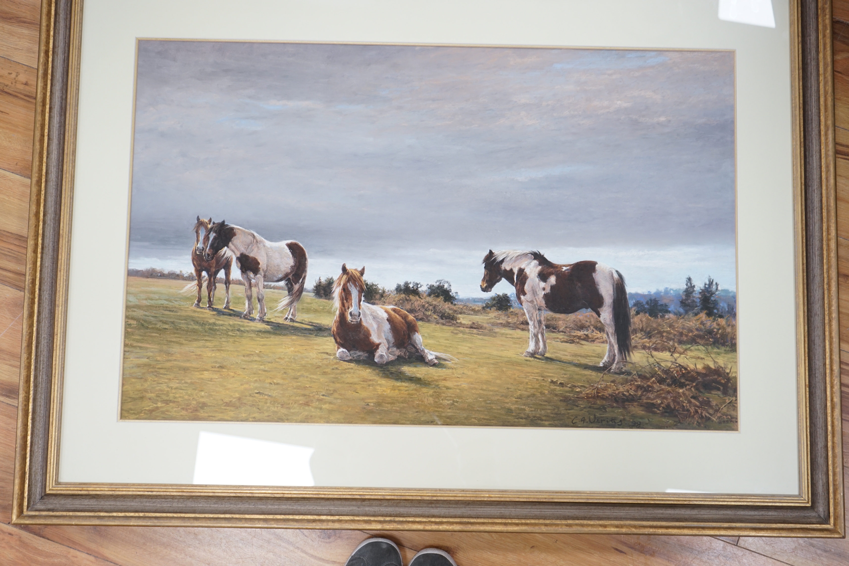 Claire Verity (20th. C) pastel, Ponies on May Hill, Gloucestershire, signed and dated '98, label verso, 55 x 87cm